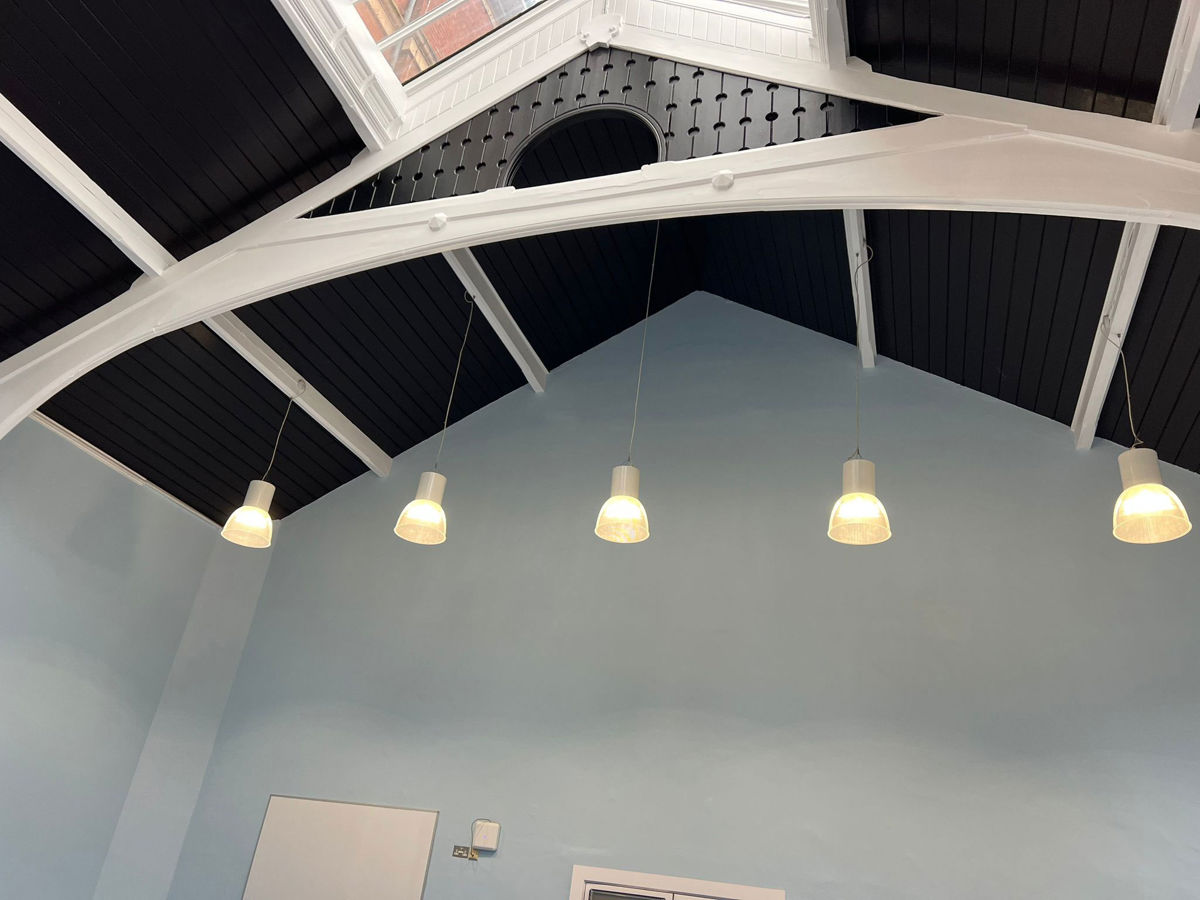 Victorian school gymnasium after plaster and paint